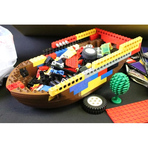 377 - Lego - A large quantity of various Lego bricks and accessories, featuring mini figures, a part-built... 