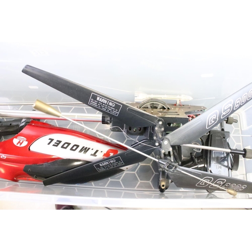 313 - Radio Control - A collection of seven R/C models to include helicopters, cars and a drone, featuring... 