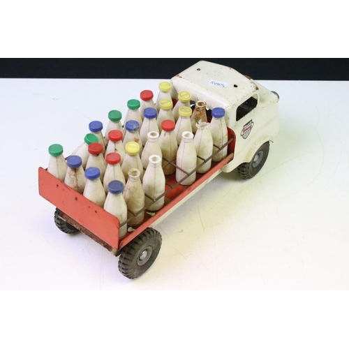 418 - Two tinplate models to include a Triang milk delivery truck with 27 plastic milk bottles with red, g... 