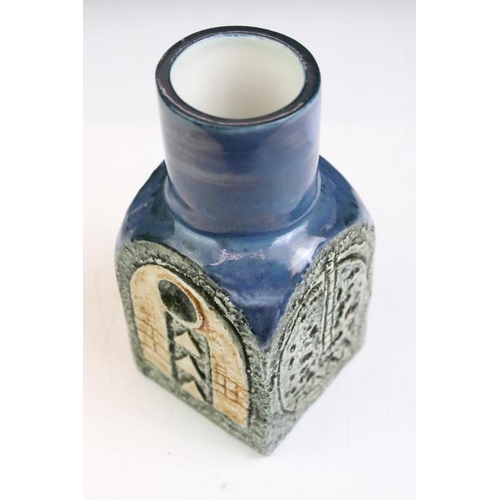 12 - Troika spice jar by Louise Jinks, with textured decoration to each face and blue-glazed neck, signed... 