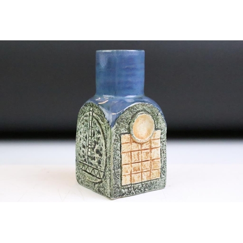 12 - Troika spice jar by Louise Jinks, with textured decoration to each face and blue-glazed neck, signed... 
