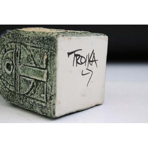 12 - Troika spice jar by Louise Jinks, with textured decoration to each face and blue-glazed neck, signed... 