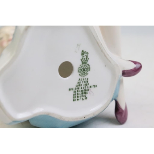 57 - Four Alice In Wonderland porcelain figures to include Royal Worcester Alice candle snuffer, modelled... 