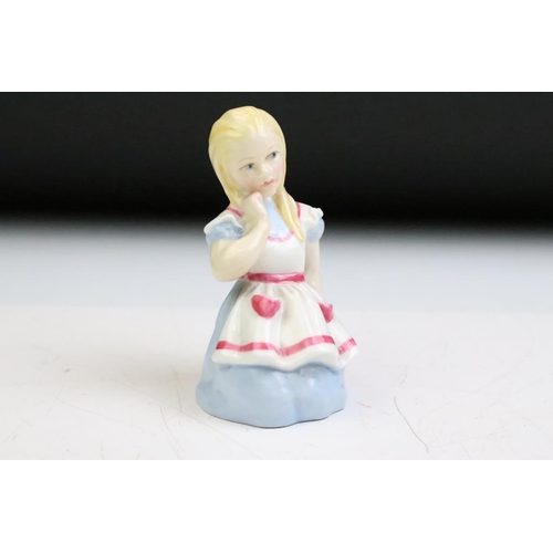 57 - Four Alice In Wonderland porcelain figures to include Royal Worcester Alice candle snuffer, modelled... 