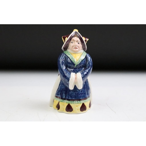 57 - Four Alice In Wonderland porcelain figures to include Royal Worcester Alice candle snuffer, modelled... 