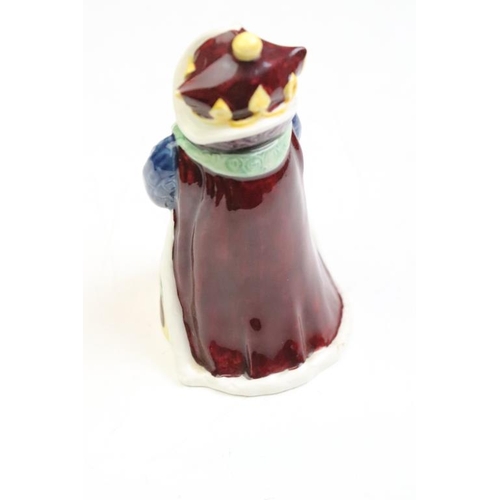 57 - Four Alice In Wonderland porcelain figures to include Royal Worcester Alice candle snuffer, modelled... 