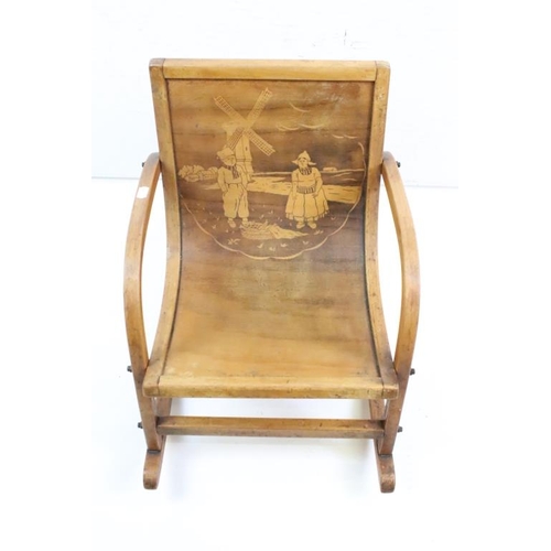650 - Mid century Bentwood Child’s Rocking Chair decorated with a Dutch Boy and Girl, 36cm wide x 44cm hig... 