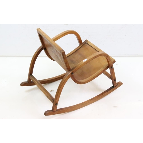 650 - Mid century Bentwood Child’s Rocking Chair decorated with a Dutch Boy and Girl, 36cm wide x 44cm hig... 
