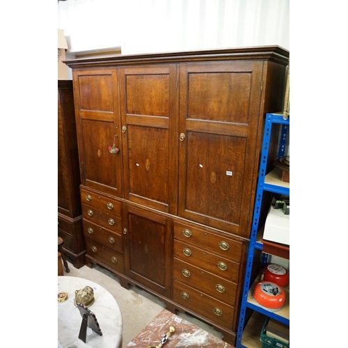652 - Early 19th century Oak House-keeper’s Cupboard, the upper section with three panel doors opening to ... 