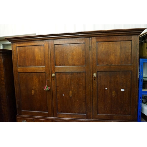 652 - Early 19th century Oak House-keeper’s Cupboard, the upper section with three panel doors opening to ... 