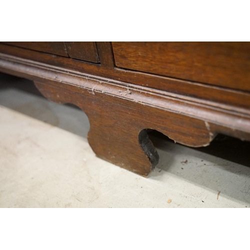 652 - Early 19th century Oak House-keeper’s Cupboard, the upper section with three panel doors opening to ... 