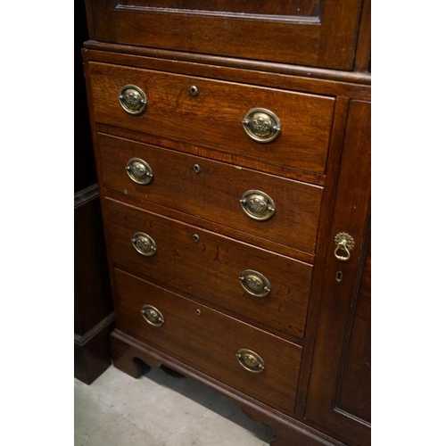 652 - Early 19th century Oak House-keeper’s Cupboard, the upper section with three panel doors opening to ... 