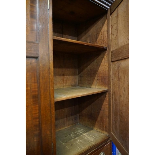 652 - Early 19th century Oak House-keeper’s Cupboard, the upper section with three panel doors opening to ... 