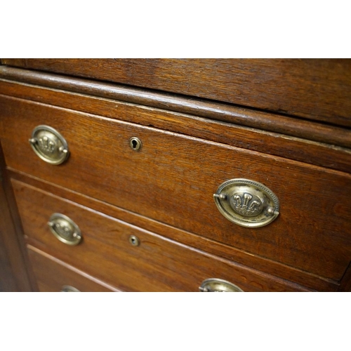 652 - Early 19th century Oak House-keeper’s Cupboard, the upper section with three panel doors opening to ... 