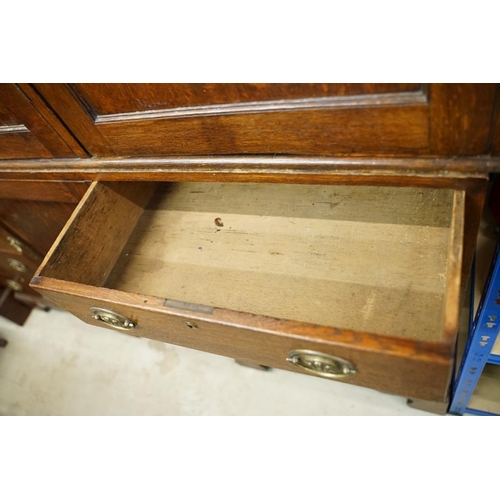 652 - Early 19th century Oak House-keeper’s Cupboard, the upper section with three panel doors opening to ... 