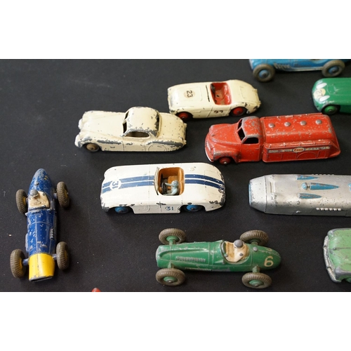 1409 - 25 Mid 20th C play worn Dinky diecast models to include 110 Aston Martin, 108 MG Midget, 111 Triumph... 