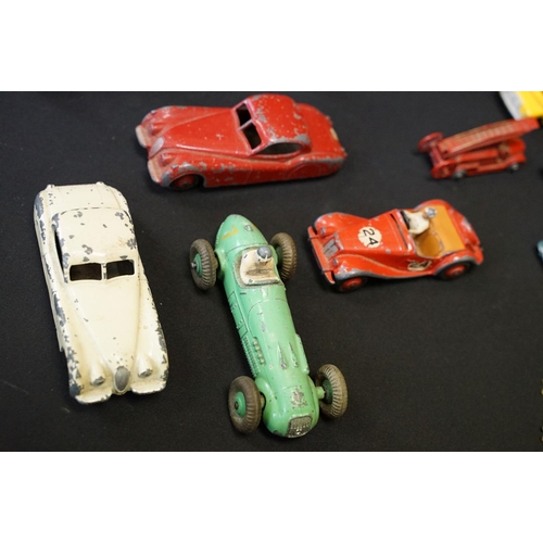 1409 - 25 Mid 20th C play worn Dinky diecast models to include 110 Aston Martin, 108 MG Midget, 111 Triumph... 