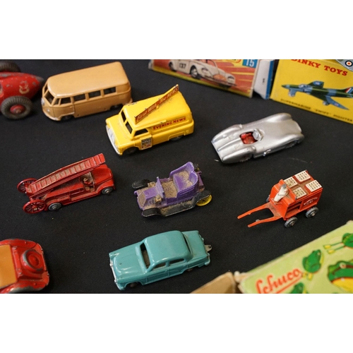 1409 - 25 Mid 20th C play worn Dinky diecast models to include 110 Aston Martin, 108 MG Midget, 111 Triumph... 