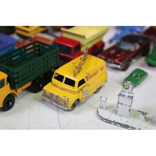 1465 - Around 60 mid 20th C onwards play worn diecast models, mostly Matchbox Lesney examples, also featuri... 