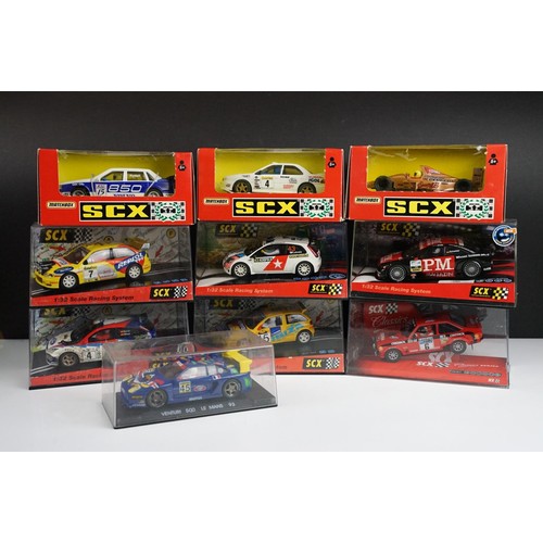 1054A - Nine boxed / cased SCX 1/32 Slot Cars to include 60460 Seat Cordoba, 62800 Ford MK II, 60580 Ford Fo... 