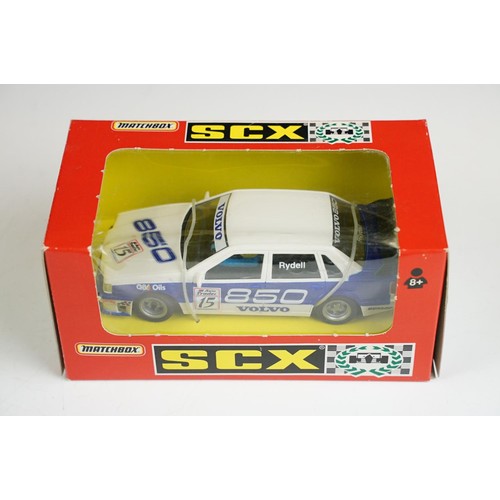 1054A - Nine boxed / cased SCX 1/32 Slot Cars to include 60460 Seat Cordoba, 62800 Ford MK II, 60580 Ford Fo... 