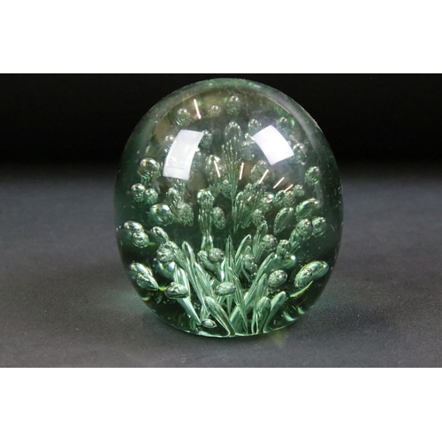 31 - Group of four 19th Century Victorian green dump glass paperweights. Each having control bubble inter... 