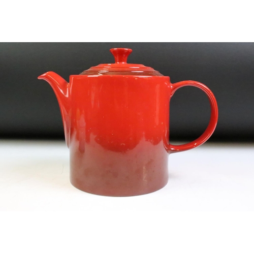 42 - Le Creuset cerise grand teapot, together with four coloured miniature twin handled lidded dish. Teap... 