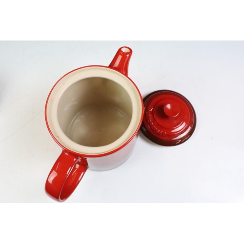 42 - Le Creuset cerise grand teapot, together with four coloured miniature twin handled lidded dish. Teap... 