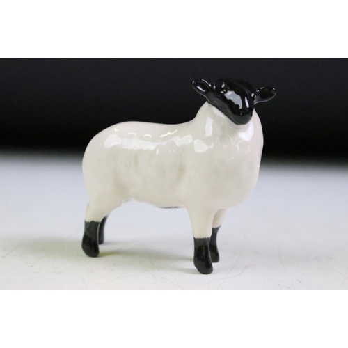 61 - Three Beswick ceramic sheep figurines to include a ewe, and two horned sheep. All with stamped marks... 