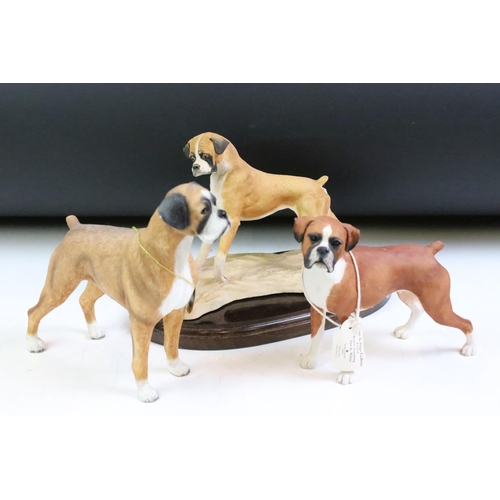 63 - Three resin boxer figurines to include Border Fine Arts, Leonardo Collection and Heritage. Tallest m... 