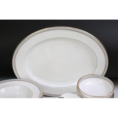 23 - Royal Worcester 'Howard' pattern part dinner service to include 11 dinner plates, 2 serving dishes, ... 