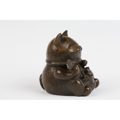 217 - An ornamental Japanese bronze 招き猫 / maneki-neko (waving / beckoning) lucky cat talisman.