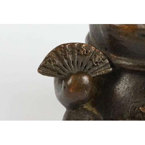 217 - An ornamental Japanese bronze 招き猫 / maneki-neko (waving / beckoning) lucky cat talisman.