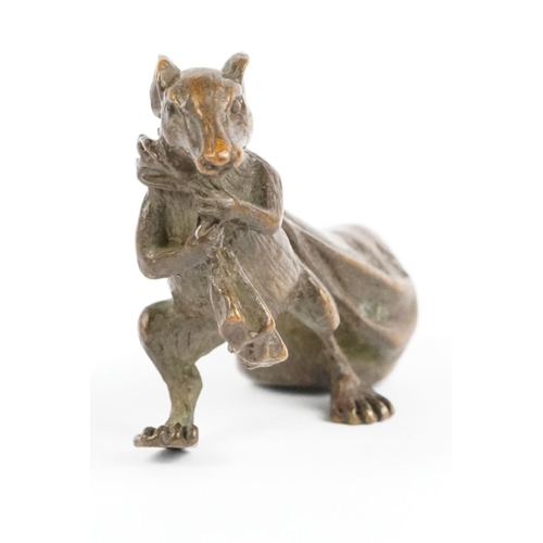 219 - An ornamental Solid bronze lucky fortune rat with bag.