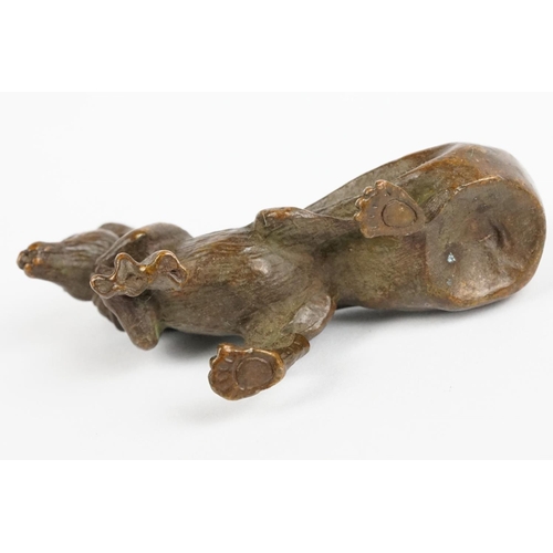 219 - An ornamental Solid bronze lucky fortune rat with bag.