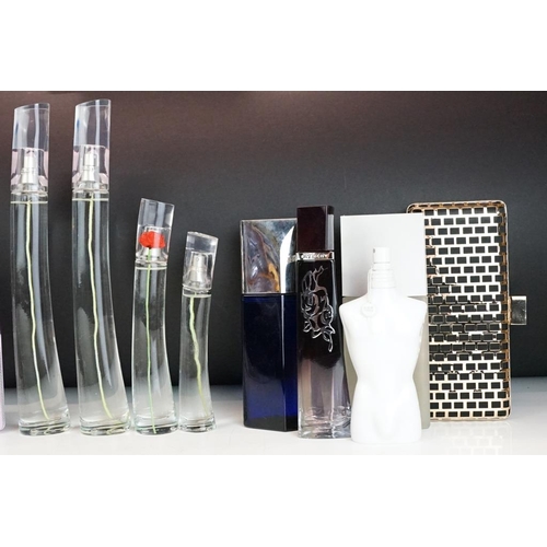 321 - A collection of perfume and scent dummy display bottles to include Yves Saint Laurent, Prada, Jean P... 