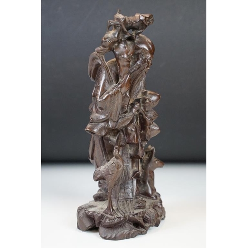 361 - Chinese carved hardwood figure depicting Shou Lau with a crane and deer to the naturalistic base. Me... 