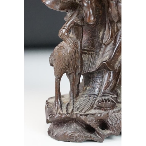 361 - Chinese carved hardwood figure depicting Shou Lau with a crane and deer to the naturalistic base. Me... 