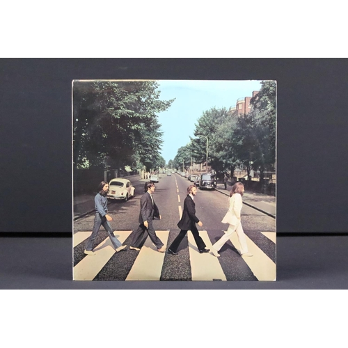 617 - Vinyl - 3 copies of The Beatles Abbey Road including one with misaligned apple with black inner (Vg+... 