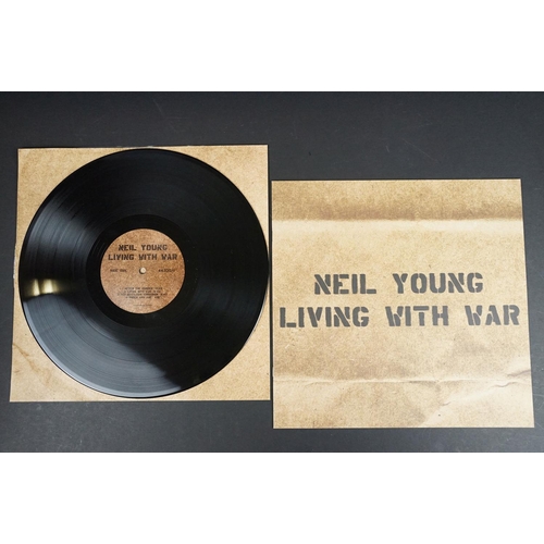 30 - Vinyl - Neil Young Living With War on Reprise Records 44335-1 with booklet.  Sleeve has small split ... 