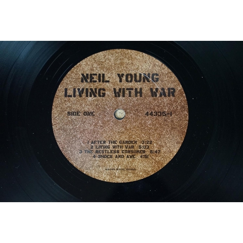 30 - Vinyl - Neil Young Living With War on Reprise Records 44335-1 with booklet.  Sleeve has small split ... 