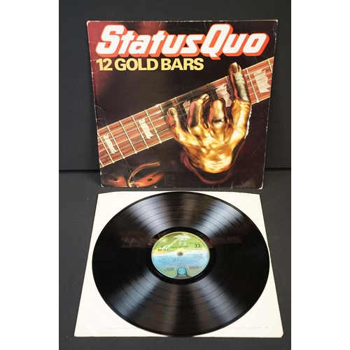 945 - Vinyl & Memorabilia - 4 Status Quo LPs and 4 Status Quo tour programmes from the 1990s / 2000s.