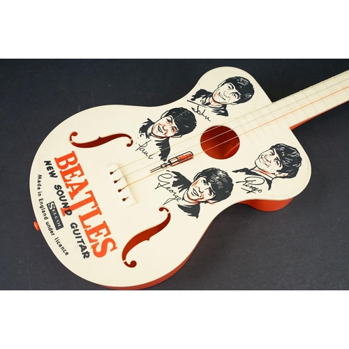 926 - Memorabilia - A Selco Beatles guitar.  Missing one tuning peg