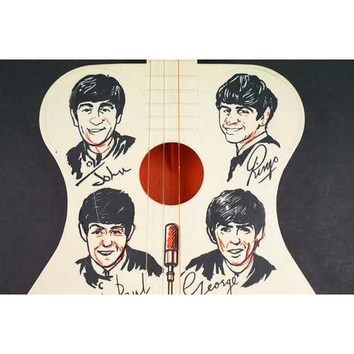 926 - Memorabilia - A Selco Beatles guitar.  Missing one tuning peg