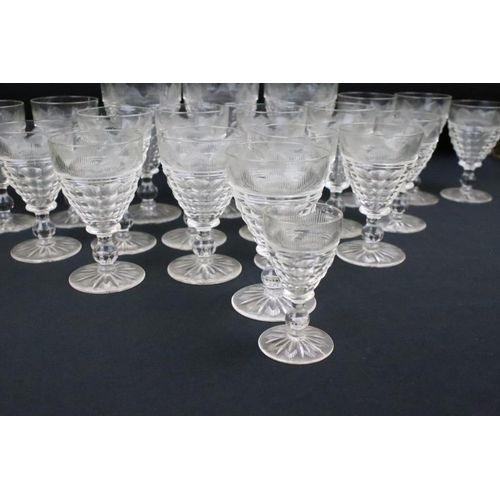 117 - Set of 21 Stuart crystal cut glass glasses of various sizes from wine to sherry. Each glass having s... 