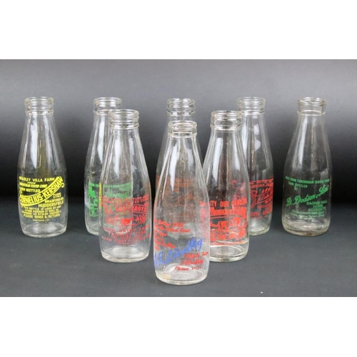 119 - Set of eight vintage glass milk bottles complete with advertising to the sides.