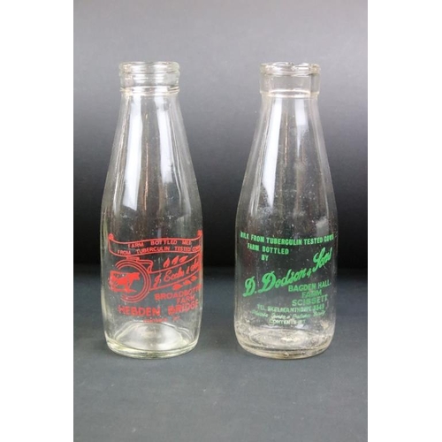 119 - Set of eight vintage glass milk bottles complete with advertising to the sides.