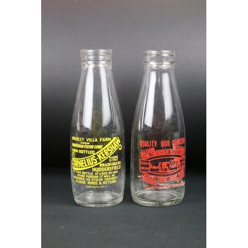 119 - Set of eight vintage glass milk bottles complete with advertising to the sides.