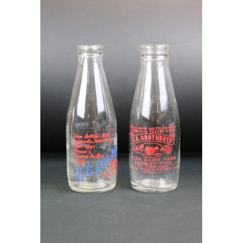 119 - Set of eight vintage glass milk bottles complete with advertising to the sides.