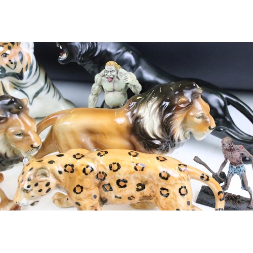 131 - Collection of ceramic big cats to include four Lomonosov lions and two Lomonosov tigers. Also includ... 